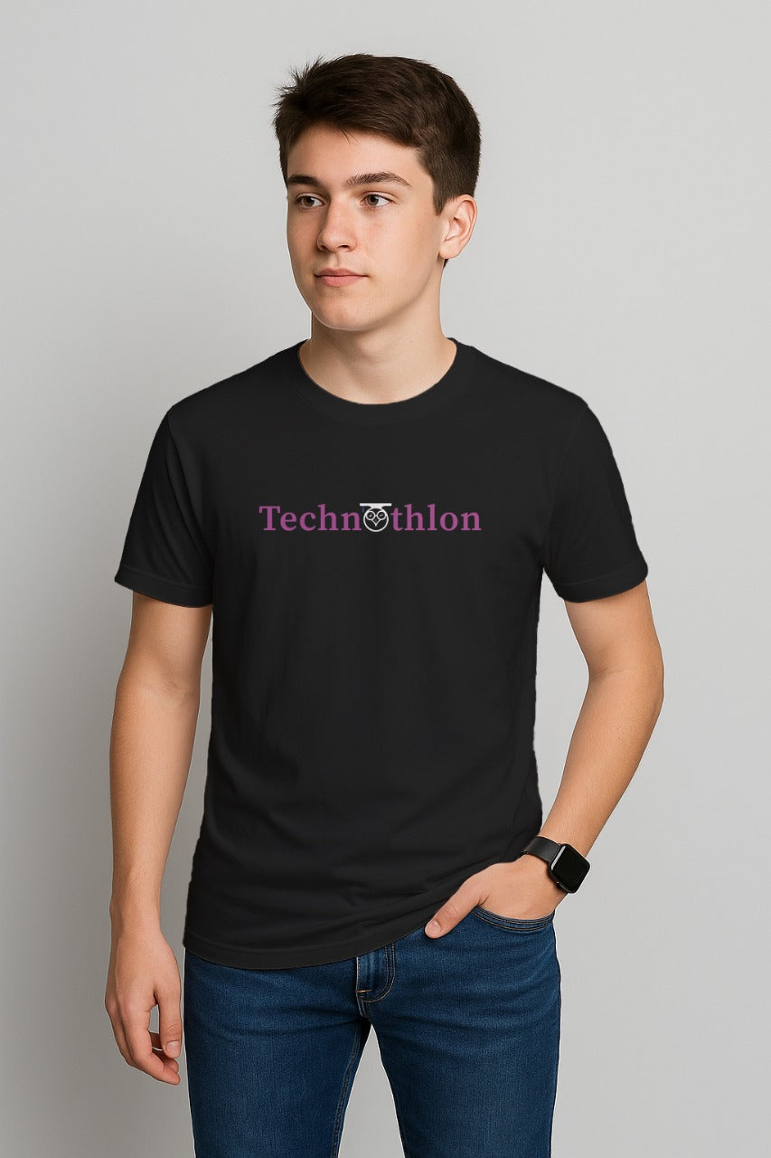 Person wearing a black t-shirt with 'Technothlon' logo on a gray background. technothlon iit guwahati