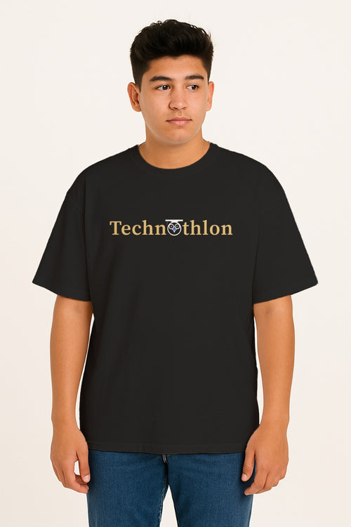 Person wearing a black t-shirt with 'Technothlon' text on a beige background. iit guwahati technothlon.